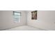 This bedroom features a neutral carpet, a window and a decorative art piece at 2550 Columbia Crossing Ct, Decatur, GA 30034
