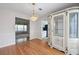 Elegant dining area with hardwood floors features a large decorative china cabinet at 2550 Columbia Crossing Ct, Decatur, GA 30034