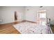 Spacious living room with hardwood floors boasts seamless transition between spaces at 2550 Columbia Crossing Ct, Decatur, GA 30034