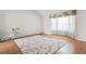 Bright living room features large window, beautiful hardwood floors, and neutral paint at 2550 Columbia Crossing Ct, Decatur, GA 30034