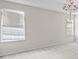 Bright main bedroom with two windows and a decorative chandelier hanging from the ceiling at 2550 Columbia Crossing Ct, Decatur, GA 30034