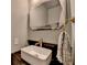 Bathroom with a modern sink, sleek fixtures, and a decorative mirror that adds a touch of elegance at 2685 Maple Park Pl # 27, Cumming, GA 30041