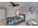 Comfortable bedroom with a ceiling fan, and a stylish floral print bedspread on a platform bed at 2685 Maple Park Pl # 27, Cumming, GA 30041