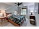 Comfortable bedroom with a ceiling fan, and a stylish floral print bedspread on a platform bed at 2685 Maple Park Pl # 27, Cumming, GA 30041