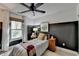 Cozy bedroom featuring modern decor, a striped bedspread, neutral walls, and soft natural light, creating a tranquil space at 2685 Maple Park Pl # 27, Cumming, GA 30041