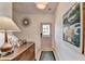 Inviting entryway with light wood flooring, modern decor, and a stylish accent mirror at 2685 Maple Park Pl # 27, Cumming, GA 30041