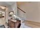Bright hallway featuring hardwood floors, stairs to the upper level, and modern lighting at 2685 Maple Park Pl # 27, Cumming, GA 30041