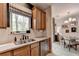 Bright, open kitchen with stainless steel appliances and easy access to dining area with natural light at 2685 Maple Park Pl # 27, Cumming, GA 30041
