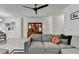 Inviting living room showcases hardwood floors, a cozy sofa, and built in shelving for storage and display at 2685 Maple Park Pl # 27, Cumming, GA 30041