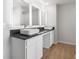 Bathroom boasts double sinks with vessel sinks, modern mirrors, and granite counters at 288 Overlook Rd, Covington, GA 30014