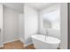 Bathroom showcasing a standalone tub with modern fixtures and separate shower at 288 Overlook Rd, Covington, GA 30014