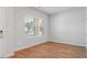 Bright bedroom with hardwood floors, two windows, and neutral paint ready for personalization at 288 Overlook Rd, Covington, GA 30014