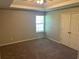 Carpeted bedroom with a large window and double door closet at 5719 Star Flower Dr, Ellenwood, GA 30294