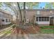 Exterior brick townhouse with small patio and screened in porch at 6700 Roswell Rd # 20D, Sandy Springs, GA 30328