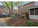 View of the home's exterior with a private patio and fenced yard space at 6700 Roswell Rd # 20D, Sandy Springs, GA 30328