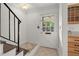 Entryway with tiled floor, stairs and white trim at 6700 Roswell Rd # 20D, Sandy Springs, GA 30328