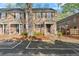 Brick townhouse with covered porch and parking in front at 6700 Roswell Rd # 20D, Sandy Springs, GA 30328