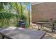 Community grilling area with picnic tables and barbecue, perfect for outdoor gatherings and summer cookouts at 6700 Roswell Rd # 20D, Sandy Springs, GA 30328