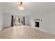 Living room with tile flooring, a fireplace, and glass doors to patio at 6700 Roswell Rd # 20D, Sandy Springs, GA 30328