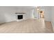 Bright living room features tile floors, a white brick fireplace, and an open layout at 6700 Roswell Rd # 20D, Sandy Springs, GA 30328