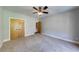 Neutral bedroom with carpet, standard closet, and light gray walls at 1762 Green Rd, Buford, GA 30518