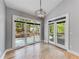 Dining area with large windows and doors providing natural light and beautiful views at 1762 Green Rd, Buford, GA 30518
