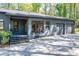 Exterior of home showcasing the driveway, three car garage, and landscaped yard at 1762 Green Rd, Buford, GA 30518