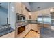 Bright kitchen featuring stainless steel appliances, granite countertops, and light wood cabinetry at 1762 Green Rd, Buford, GA 30518