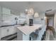 Modern kitchen with quartz counters, stainless steel appliances, and an island with bar seating at 1762 Green Rd, Buford, GA 30518