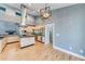 Open concept kitchen with stainless appliances, granite counters, and seamless flow to living space at 1762 Green Rd, Buford, GA 30518