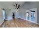 Open living space features hardwood floors, vaulted ceiling, and French doors to deck at 1762 Green Rd, Buford, GA 30518