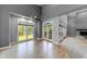 Spacious living room with hardwood floors, high ceilings, and large windows providing ample natural light at 1762 Green Rd, Buford, GA 30518