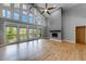 Bright and airy living room with fireplace, high ceilings, and scenic views at 1762 Green Rd, Buford, GA 30518