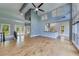 Spacious living room featuring high ceilings, large windows and seamless flow to kitchen at 1762 Green Rd, Buford, GA 30518