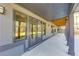 A covered patio is shown with wooden columns and multiple windows, a beautiful space for outdoor enjoyment at 1762 Green Rd, Buford, GA 30518