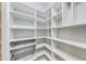 Organized walk-in closet with shelving and drawers providing ample storage space at 1762 Green Rd, Buford, GA 30518
