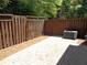 Paved backyard patio with wood fence at 1835 Morning Star Ln, Tucker, GA 30084