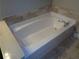 Bathroom features a large soaking tub and tile backsplash at 1835 Morning Star Ln, Tucker, GA 30084