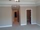 Bedroom features tray ceiling, closet, and doorway access to more rooms at 1835 Morning Star Ln, Tucker, GA 30084