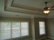 Bedroom boasts tray ceilings, crown molding, and bright natural light at 1835 Morning Star Ln, Tucker, GA 30084
