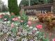 Avery Hills entrance sign surrounded by colorful flowers and lush greenery at 1835 Morning Star Ln, Tucker, GA 30084