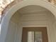 Close up of front door framed by classic white trim and arched brick doorway at 1835 Morning Star Ln, Tucker, GA 30084