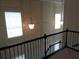 Hallway view showcases decorative lighting fixtures and paneled walls at 1835 Morning Star Ln, Tucker, GA 30084