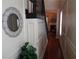 Hallway with hardwood floors and elegant trim leading to a living area with fireplace at 1835 Morning Star Ln, Tucker, GA 30084