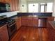 Modern kitchen featuring stainless steel appliances, wood cabinets, and a stylish countertop at 1835 Morning Star Ln, Tucker, GA 30084
