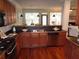 Spacious kitchen features stainless appliances, dark countertops, and hardwood floors at 1835 Morning Star Ln, Tucker, GA 30084
