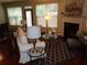 Cozy living room with hardwood floors, fireplace, and comfortable seating at 1835 Morning Star Ln, Tucker, GA 30084