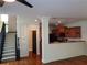 Open-concept living space with staircase and kitchen access at 1835 Morning Star Ln, Tucker, GA 30084