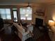 Bright living room with fireplace, hardwood floors, and stylish furniture at 1835 Morning Star Ln, Tucker, GA 30084