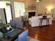 Open-concept living room featuring hardwood floors, fireplace, and elegant decor at 1835 Morning Star Ln, Tucker, GA 30084